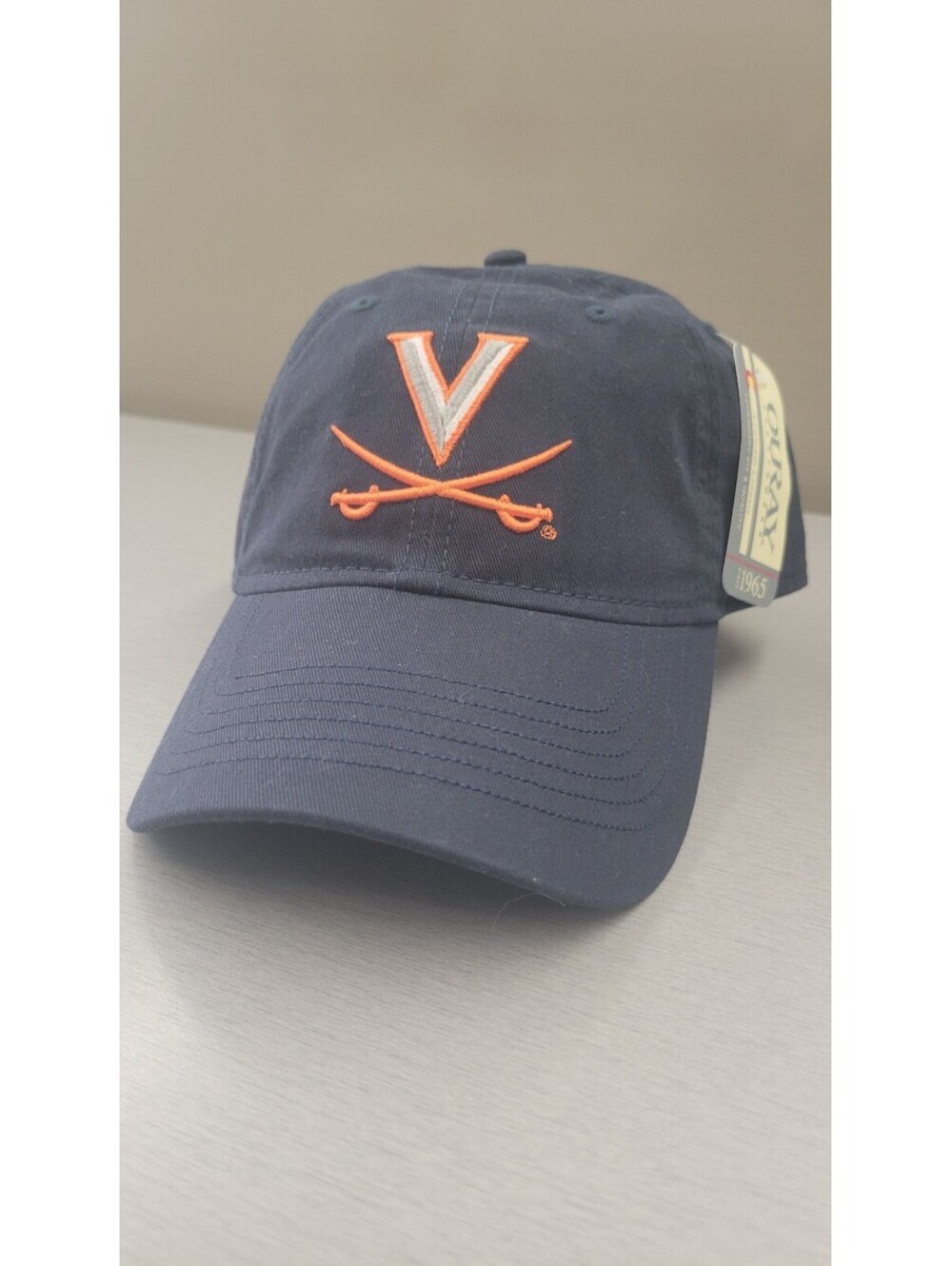 Ouray Sportswear Navy Blue Cotton Baseball Cap with Orange Embroidered Logo